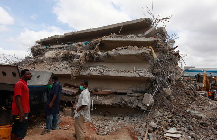 In this photo taken on Saturday, Sept. 13, 2014, rescue workers search for survivors in the rubble of a collapsed building belonging to the Synagogue Church of All Nations in Lagos, Nigeria. 