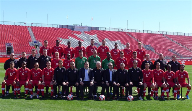 Members of the Canadian men's national soccer team and staff pose for a team photo at BMO Field in Toronto, Monday, Sept.8, 2014. 