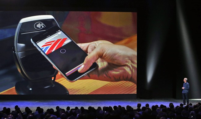 Apple CEO Tim Cook introduces the new Apple Pay product in Cupertino, Calif.