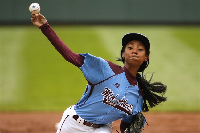 In this Aug. 15, 2014, file photo, Pennsylvania's Mo'ne Davis delivers in the first inning against Tennessee during a baseball game at the Little League World Series tournament in South Williamsport, Pa.