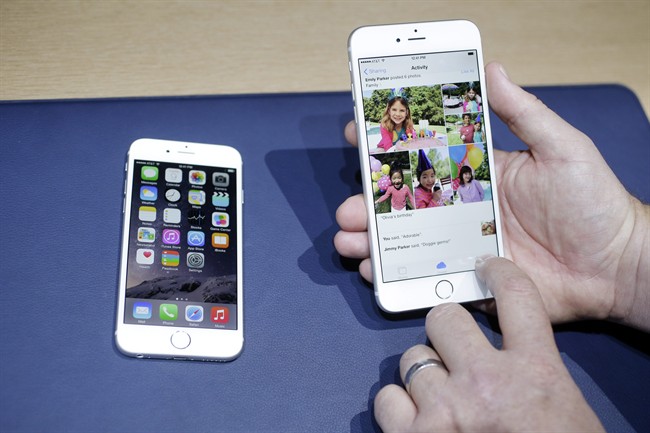n this Sept. 9, 2014, file photo, the iPhone 6, at left, and iPhone 6 plus are shown next to each other during a new product release in Cupertino, Calif. 