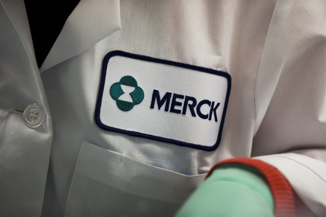 FILE - In this Thursday, Feb. 28, 2013 file photo, a Merck logo is placed on scientist's lab coat in West Point, Pa.