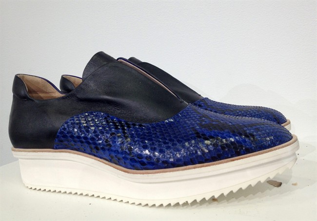 Reed Krakoff's sporty, feminine presentation Wednesday at New York Fashion Week included macrame raffia, perforation, supple leather in cobalt blue and some killer handbags.