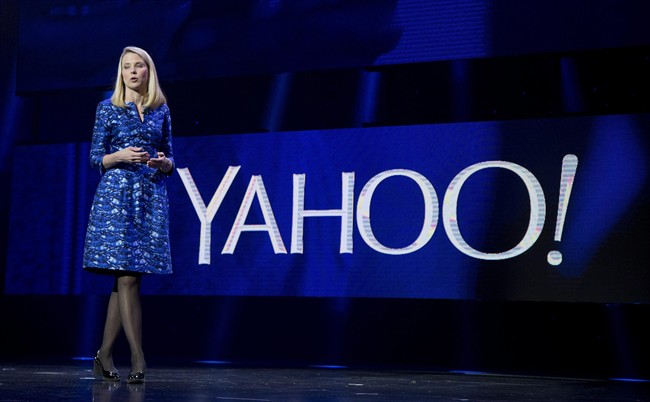 FILE - In this Jan. 7, 2014 file photo, Yahoo President and CEO Marissa Mayer speaks during the International Consumer Electronics Show in Las Vegas. In a letter on Friday, Sept. 26, 2014, activist investor Jeffrey Smith urged Yahoo Inc. to buy another fallen Internet star, AOL Inc. and take steps to reduce the future taxes on the company’s lucrative stake in China’s Alibaba Group.