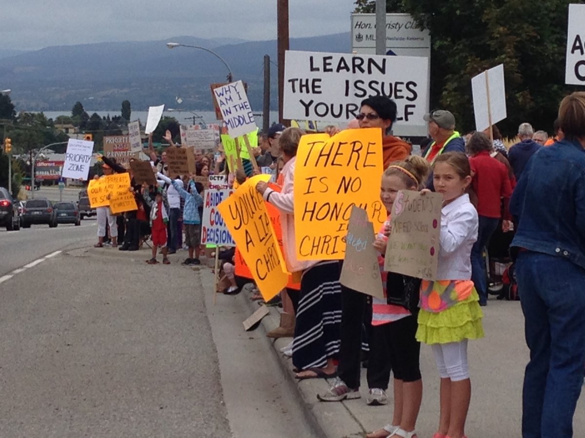 Students and parents take to the streets of West Kelowna Tuesday to demand the start of school and an end to the labour dispute with teachers. 