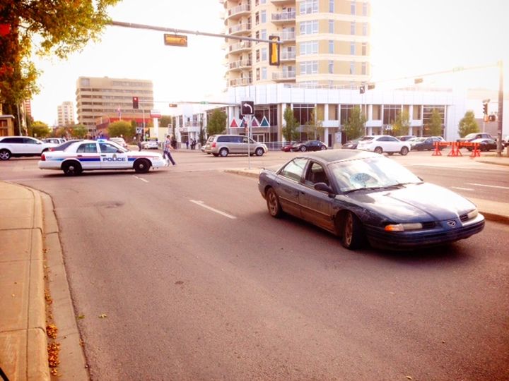 A car sits in the area of 105 Street and 104 Avenue in downtown Edmonton Wednesday, September 24, 2014 after a series of hit-and-runs.