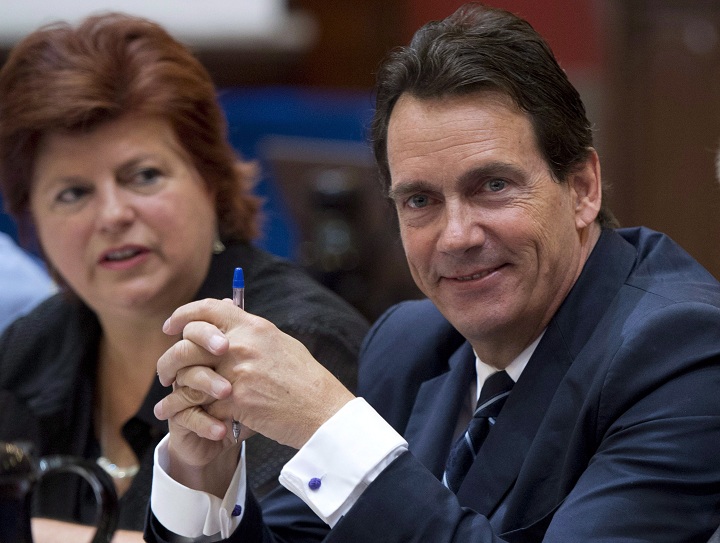 Parti Quebecois Opposition MNA Pierre-Karl Peladeau, right, and colleague Nicole Leger, at the beginning of a party caucus meeting to prepare for the fall session, Wednesday, September 10, 2014 at the legislature in Quebec City.