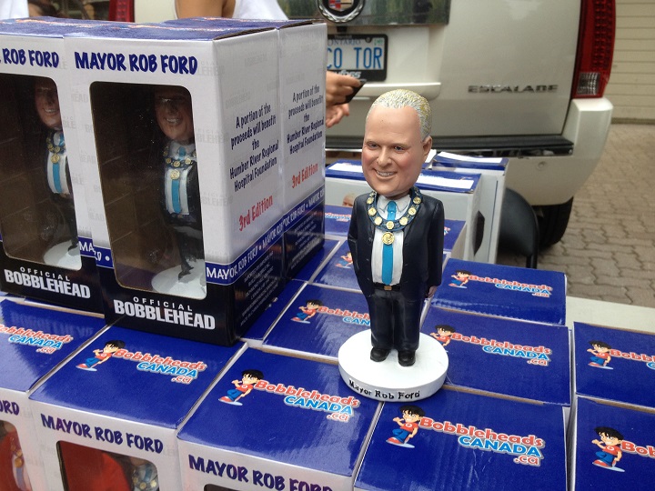 Supporters line up to purchase Rob Ford bobbleheads at the mayor's mother's house on Sept. 1, 2014.