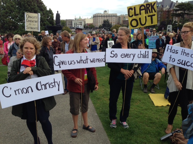 Teachers protest on the steps of the Legislature in Victoria. 