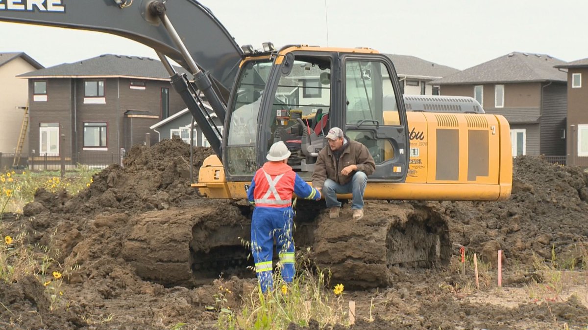 Sask 1st Call safety patroller Reg Welsh visits an excavation site in Regina's Harbour Landing neighbourhood.