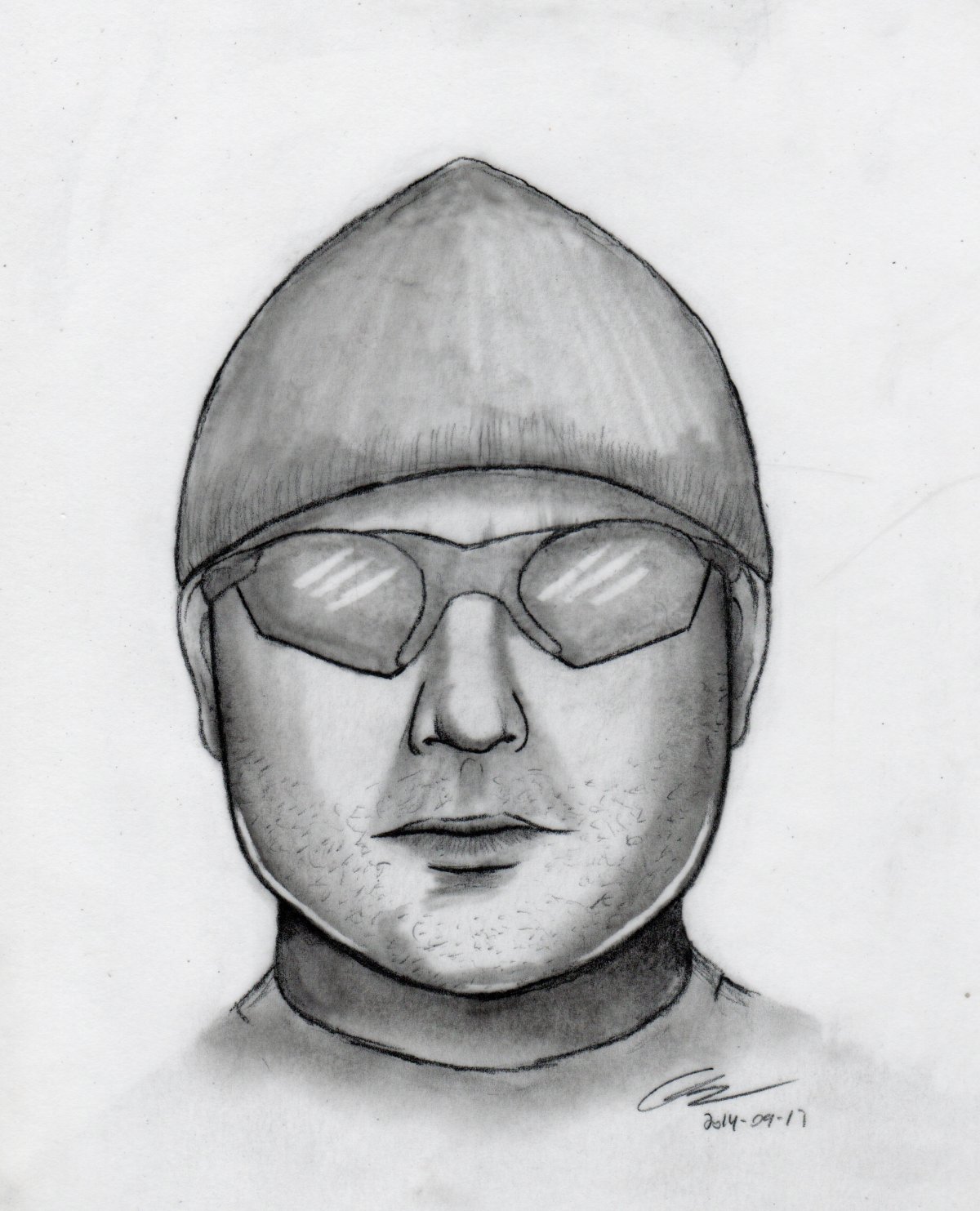 Composite drawing of robbery suspect.