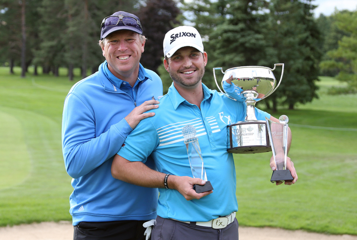Ryan Williams (R) and caddie Robert Thompson (L) after the fourth round of the PGA Tour Canada Championship at Sunningdale Golf & Country Club on September 14, 2014 in London, Ontario.