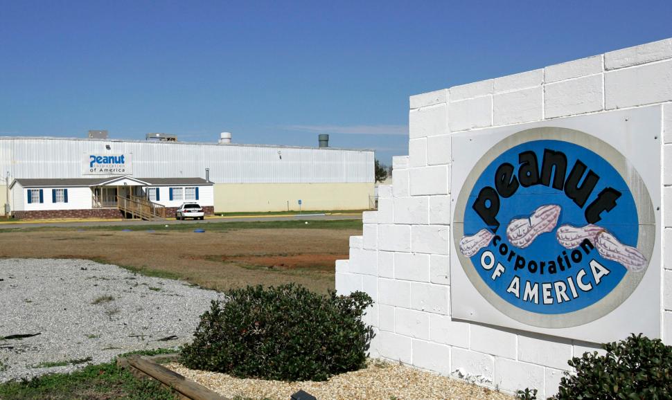 In this Jan. 29, 2009 file photo, an Early County, Ga. Sheriff's car sits parked in front of the the Peanut Corporation of America processing plant in Blakely, Ga. (AP Photo/Ric Feld, File).