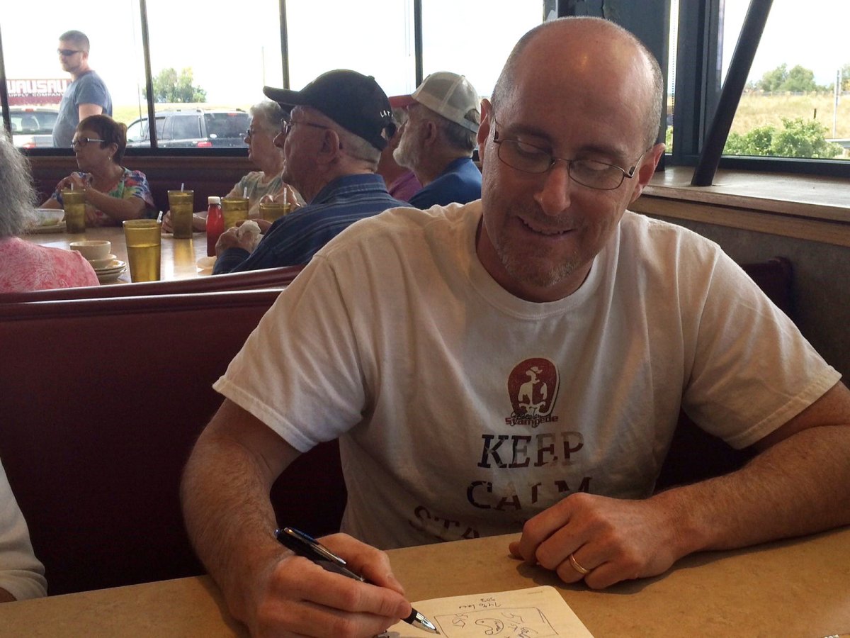 Jeffrey Hare, the leader of Colorado's 51st State Initiative, sketches out a map to explain his plans for a separate state of North Colorado, during an interview at a truckstop diner in Fort Collins, Colo., on Aug. 21, 2014. THE CANADIAN PRESS/Alex Panetta.