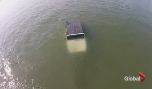 The Jeep submerged in the water.