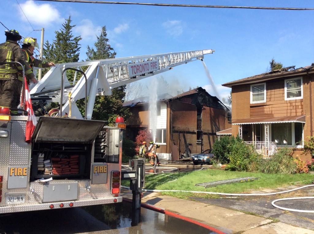 Crews battle a large fire at a semi-detached home on Sun Valley Drive