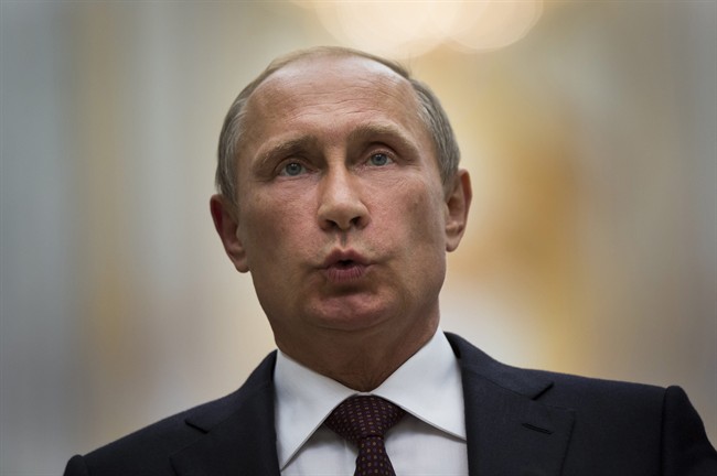 FILE - In this Wednesday, Aug. 27, 2014 file photo, Russian President Vladimir Putin speaks to the media.