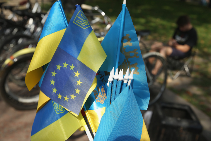 A Ukrainian flag mixed with the flag of the European Union stands among flags for sale at a vendor's stall on September 14, 2014 in Lviv, Ukraine. 
