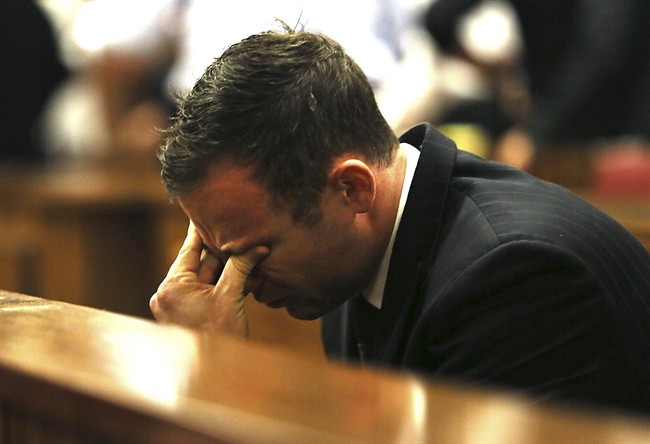 Oscar Pistroius puts his hand to his face in court in Pretoria, South Africa, Friday, Sept. 12, 2014. 