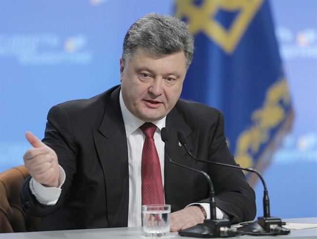 Ukrainian President Petro Poroshenko gestures during a press conference in Kiev, Ukraine, Thursday, Sept. 25, 2014.  (AP Photo/Efrem Lukatsky).