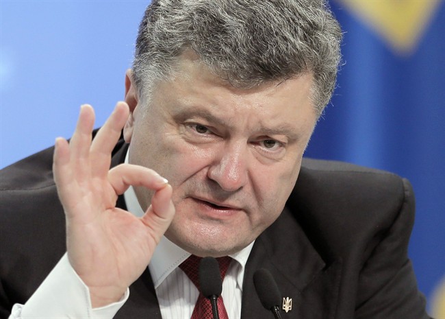 Ukrainian President Petro Poroshenko gestures in Kiev on Thursday, Sept. 25, 2014.