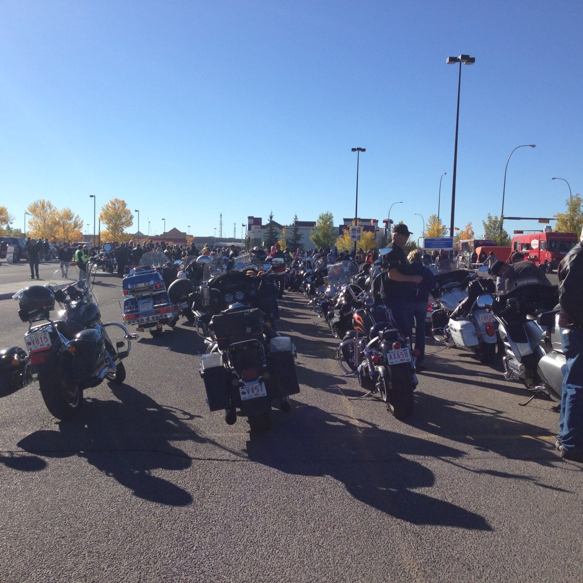 Motorcyclists parked at the Walmart in Shawnessy for the Magic of Christmas motorcycle toy run.   
