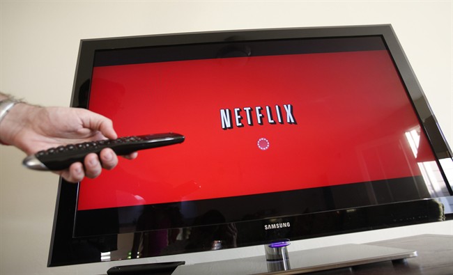 In this July 20, 2010 file photo, a person uses Netflix in Palo Alto, Calif. 