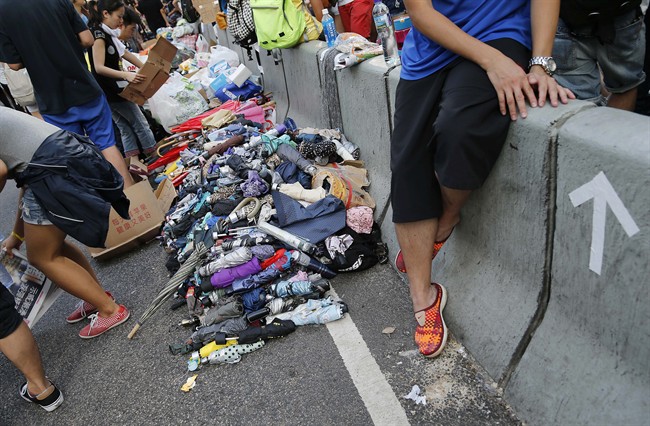 Stacks of umbrellas are ready for pro-democracy protesters’ use to shield themselves from pepper spray Monday, Sept. 29, 2014 in Hong Kong.