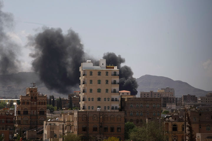 Smokes rises from an area due to clashes between Sunni militiamen and Hawthi Shiite rebels in Sanaa, Yemen, Sunday, Sept. 21, 2014. Yemen's top security body imposed an overnight curfew in restive areas of the capital, Sanaa, on Saturday after Shiite rebels took over the state television building amid heavy clashes and the U.N. envoy to the country signaled that a deal had been reached to end the violence.