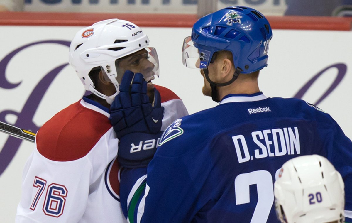 P.K. Subban and Daniel Sedin exchange words during second period NHL hockey action. 