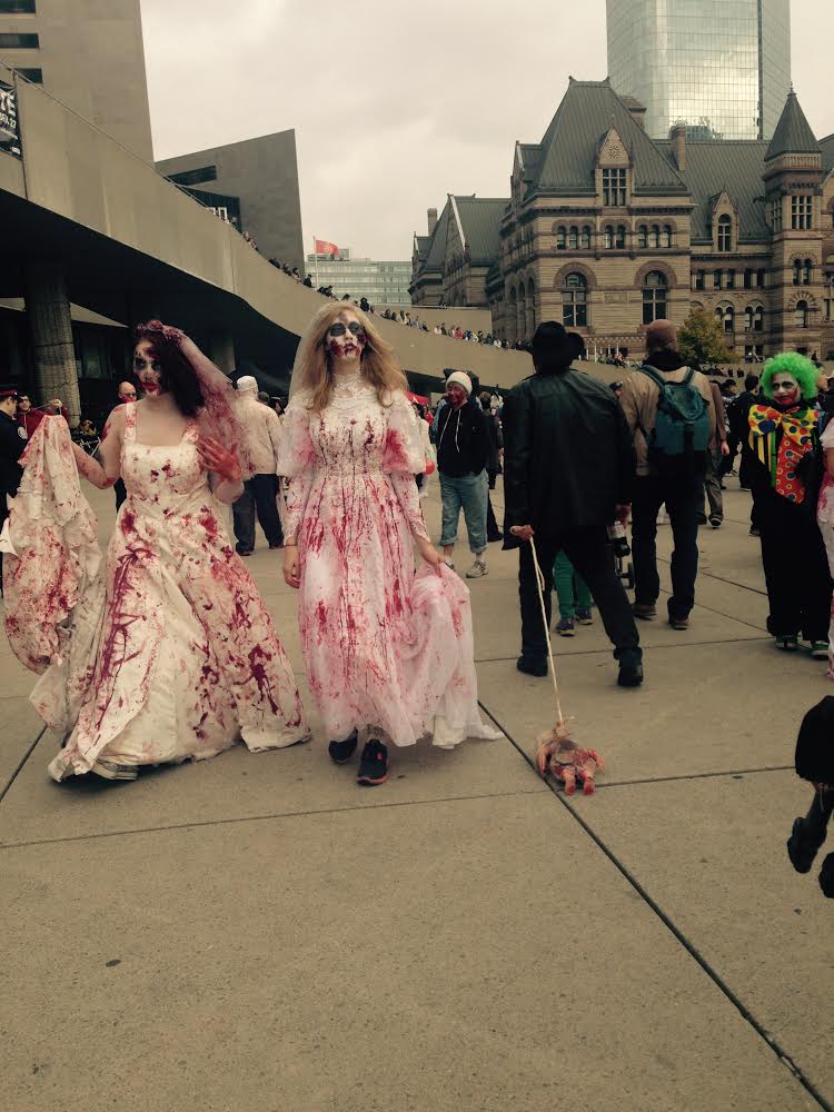 Zombie brides were among the undead who marched through Toronto streets in the city’s annual Zombie Walk on Saturday, Oct. 25.