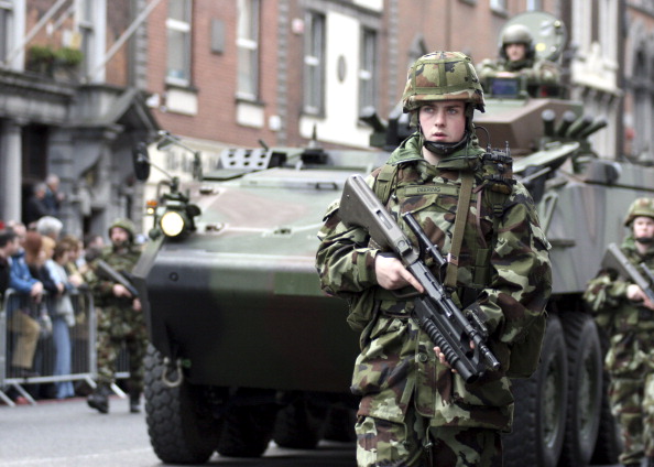 Members of the Irish armed forces take part in Ireland's first military parade in 35 years, to celebrate the 90th anniversary of the 1916 Easter rebellion against British rule in Ireland on April 16, 2006.