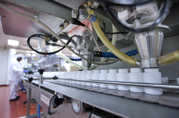 Empty pill bottles are filled with Apo-Clonidine, an antihypertensive or vascular stabilizer, at the Apotex Inc. plant in Toronto, Ontario, Canada, on Wednesday, Nov. 3, 2011. 