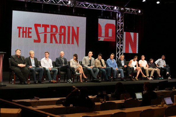 Co-creator/executive producer/director Guillermo del Toro, executive producer Carlton Cuse, co-creator/executive producer Chuck Hogan, actors Corey Stoll, Mia Maestro, Kevin Durand, Sean Astin, Jonathan Hyde, Richard Sammel, Natalie Brown, Miguel Gomez, Ben Hyland and Jack Kesy speak onstage at 'The Strain' panel during the FX Networks portion of the 2014 Summer Television Critics Association at The Beverly Hilton Hotel on July 21, 2014 in Beverly Hills, California. 