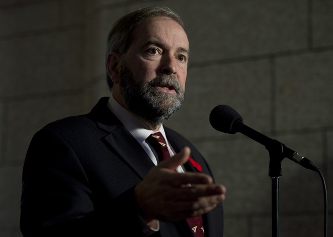 NDP Leader Tom Mulcair speaks with the media on Parliament Hill, Wednesday October 29, 2014 in Ottawa. 