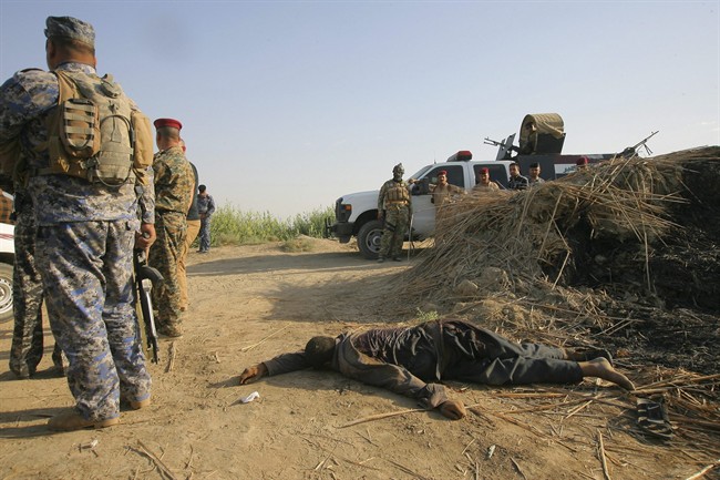Islamic State group publicly kills 6 Iraqi troops
