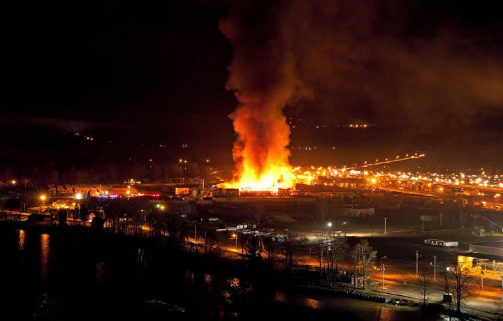 A large fire burns at the Lakeland Mills sawmill in Prince George, B.C., on Tuesday April 24, 2012. An explosion rocked the sawmill just before 10 p.m. local time setting off a fire that engulfed the facility. 