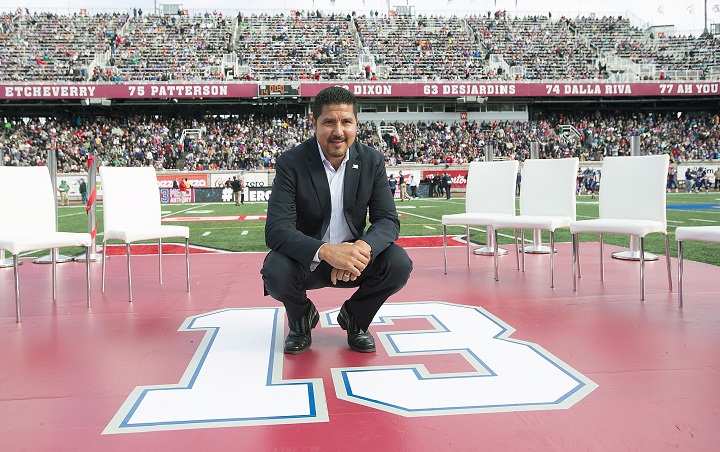 Former Montreal Alouettes quarterback Anthony Calvillo poses for a photo in Montreal, Monday, October 13, 2014, following a halftime ceremony to retire his jersey at a CFL game between the Alouettes and the Saskatchewan Roughriders.