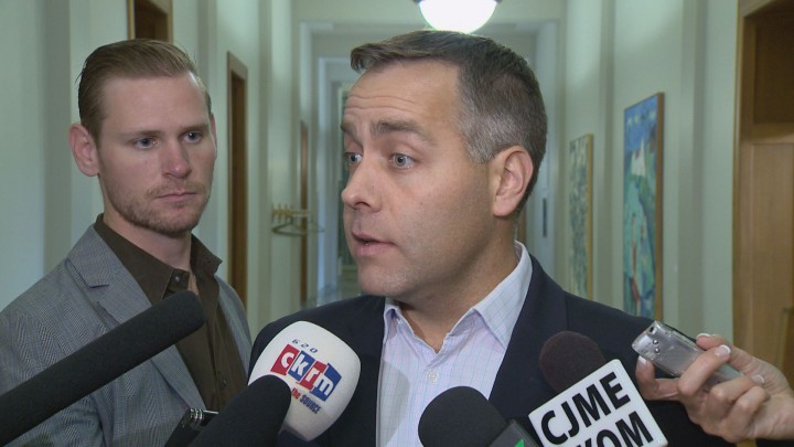 Saskatchewan's Opposition says the government is violating the balanced budget legislation with deficit plan.