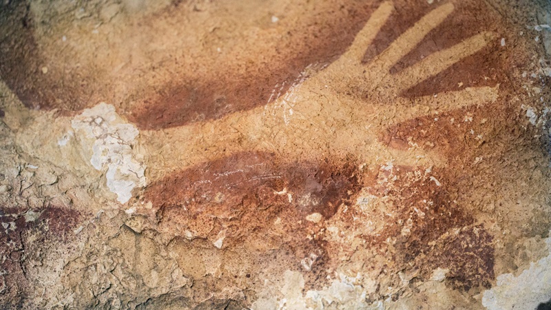 This undated handout photo provided by Nature Magazine shows stencils of hands in a cave in Indonesia. Ancient cave drawings in Indonesia are as old as famous prehistoric art in Europe, according to a new study that shows our ancestors were drawing all over the world 40,000 years ago. And it hints at an even earlier dawn of creativity in modern humans, going back to Africa, than scientists had thought. 