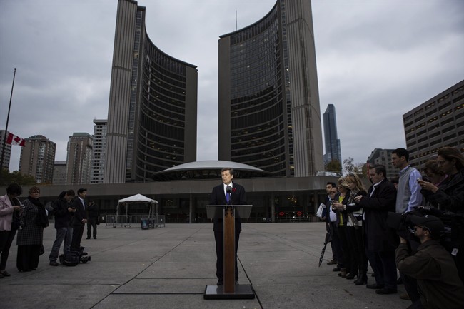 Mayor-elect John Tory speaks to reporters outside city hall in Toronto on Tuesday, October 28, 2014. 