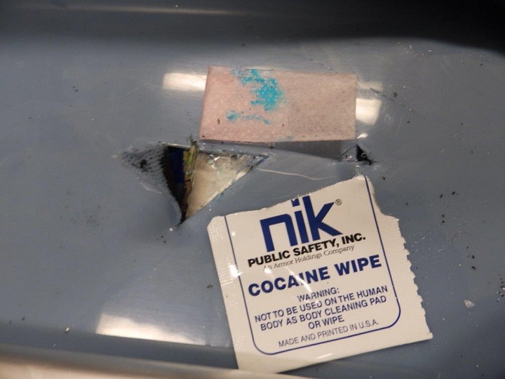 Photo of the test showing a positive reaction for the presence of cocaine.