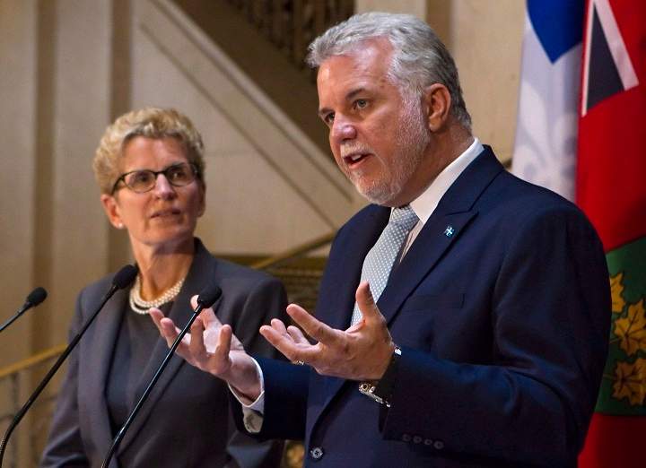 Quebec Premier Philippe Couillard, right, and Ontario Premier Kathleen Wynne in Quebec City. The premiers of Quebec and Ontario are vowing to work together to restore Central Canada's traditional influence with the rest of the country, especially on economic growth.