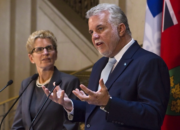 Quebec Premier Philippe Couillard, right, and Ontario Premier Kathleen Wynne in Quebec City. The premiers of Quebec and Ontario are vowing to work together to restore Central Canada's traditional influence with the rest of the country, especially on economic growth.