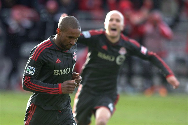 Toronto FC 's Jermain Defoe, left, celebrates after scoring against D.C. United with teammate Michael Bradley during second half MLS action in Toronto on March 22, 2014. Toronto FC fans may have seen the last of Jermain Defoe. The 32-year-old England striker has aggravated a groin injury and will miss Saturday's home finale against the Montreal Impact. His status for the season finale in New England is up in the air, as his future in Major League Soccer.