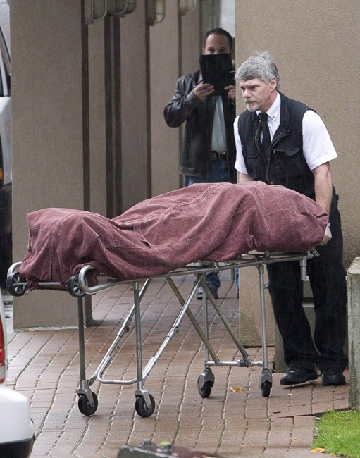A worker loads a body into a van following a multiple homicide in Surrey, B.C. Sunday, Oct. 21, 2007, as six people were found dead in an apartment building. It was a shocking gangland crime that could rightfully be called a bloodbath: six men murdered, execution-style, two of them innocent bystanders who happened to be in the wrong place.Two of the men accused in what's come to be known as the "Surrey Six" slayings. THE CANADIAN PRESS/Jonathan Hayward.