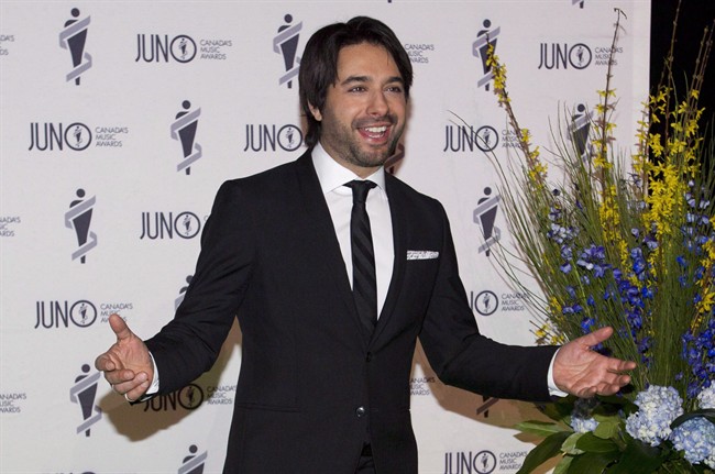 Jian Ghomeshi arrives on the green carpet for the Juno Gala in Winnipeg on Saturday, March 29, 2014.