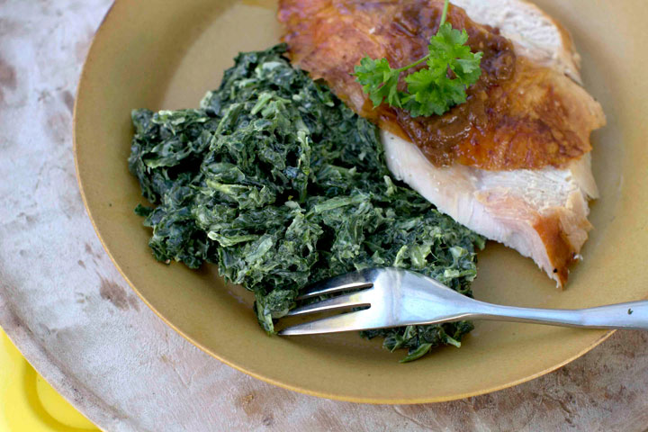 This Oct. 20, 2014, photo shows garlic creamed spinach in Concord, N.H. The simple creamed spinach requires little effort beyond slowly simmering heavy cream.