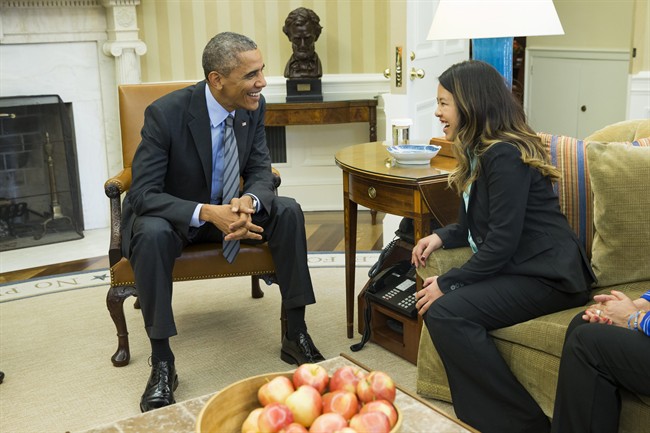 President Barack Obama meets with Ebola survivor Nina Pham in the Oval Office of the White House in Washington, Friday, Oct. 24, 2014. 