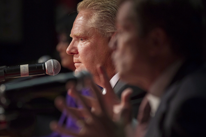 Doug Ford (centre) sits next to John Tory (right) and Olivia Chow as he takes part in a Toronto Mayoral Debate in Toronto on Tuesday, September 23, 2014.